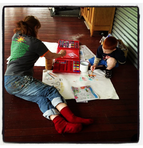 Grandparent and grandchild learn about each other through drawing together.